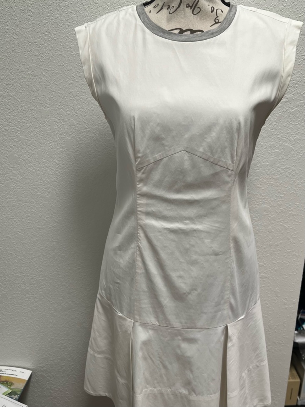 Rebecca Taylor cap-sleeve mini dress featuring a pleated skirt and a grey trim.